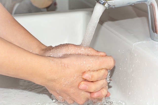 Image of running tap water on hands to support the text