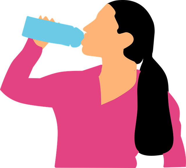 Image of a woman drinking water to support the text, water is essential during exercise