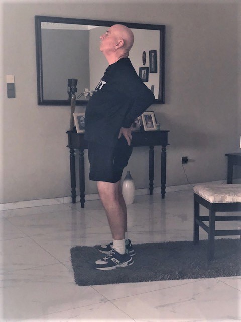 This standing back stretch Improves the range of motion in your spine and trunk. for senior mobility